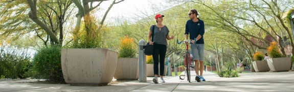 Two students walking on campus